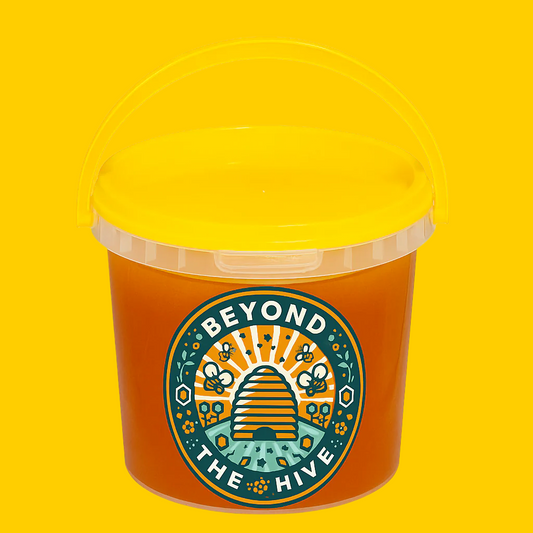 Yellow lid and 1kg container with 'Beyond The Hive' logo on a yellow background